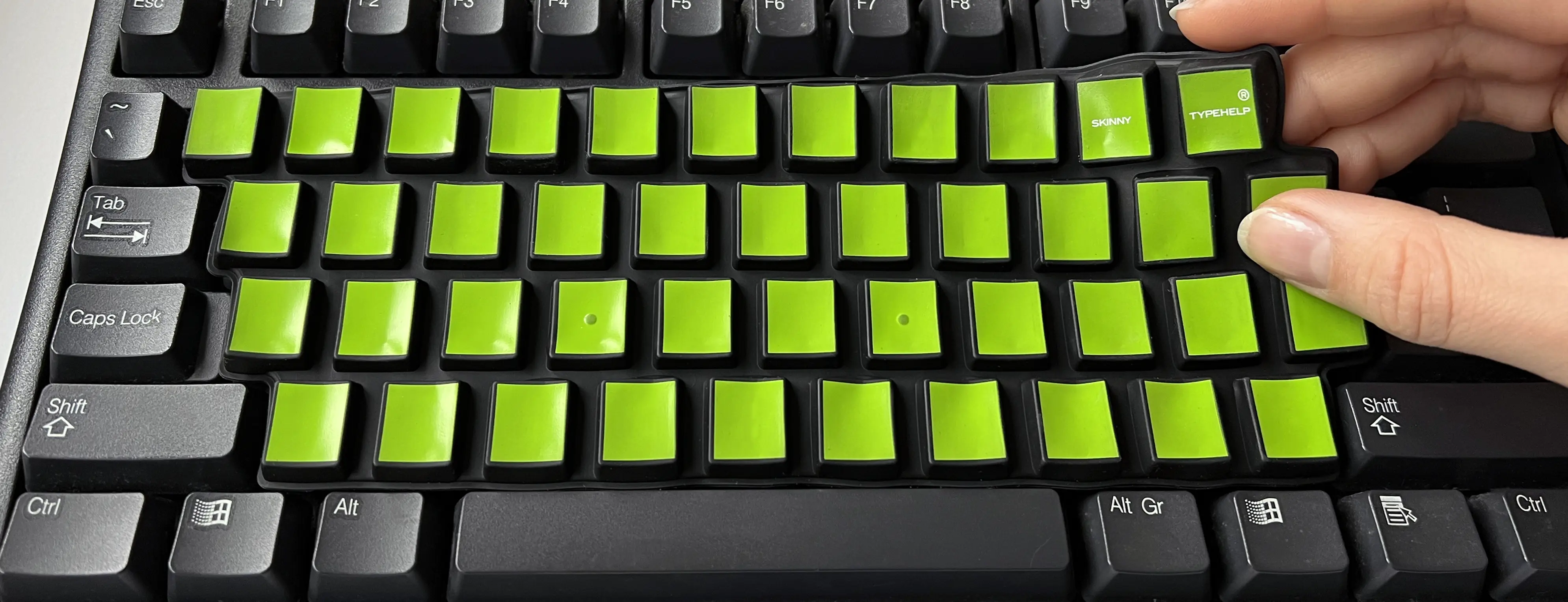 SkinnyTypehelp modèle DesktopPC sur un clavier séparé s'enlève facilement avec deux doigts